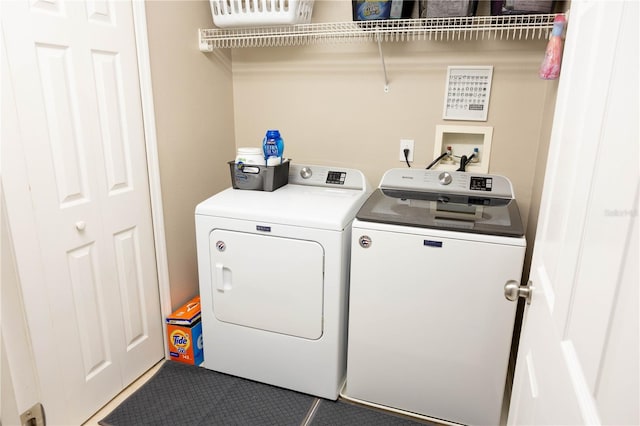 washroom featuring laundry area and independent washer and dryer