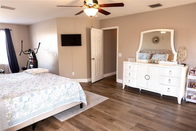 bedroom featuring dark wood-style floors, baseboards, visible vents, and ceiling fan