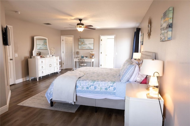 bedroom with baseboards, visible vents, ceiling fan, and wood finished floors