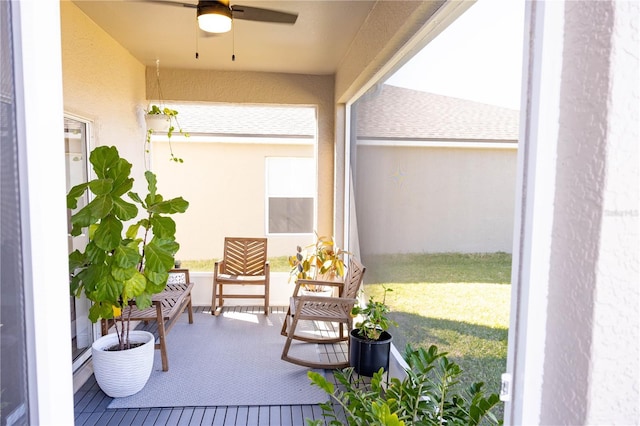 balcony featuring ceiling fan and a porch