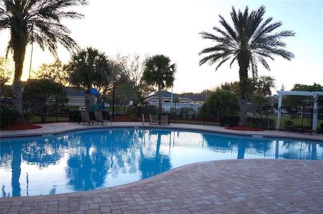 community pool featuring fence