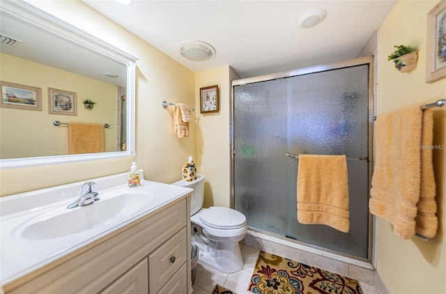 full bathroom with toilet, a stall shower, vanity, and tile patterned floors