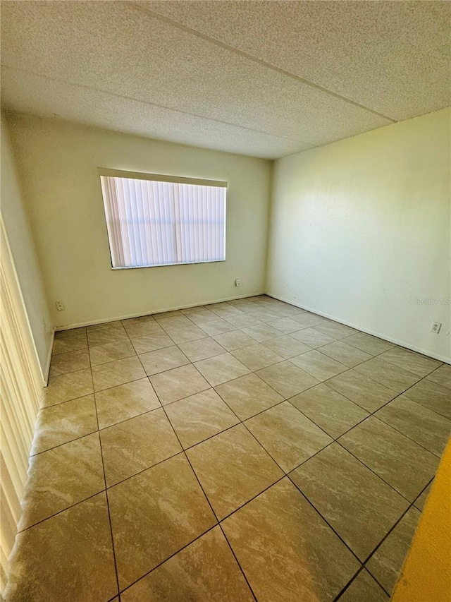 empty room featuring tile patterned flooring