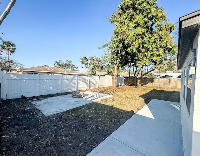 view of yard with a patio area and a fenced backyard