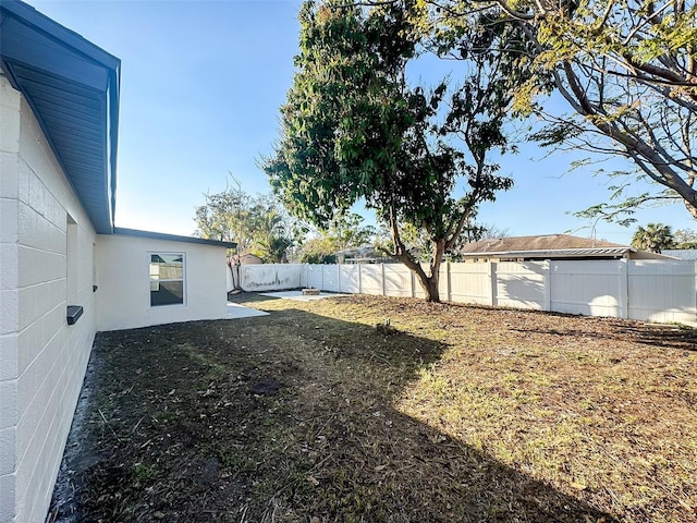 view of yard with a fenced backyard