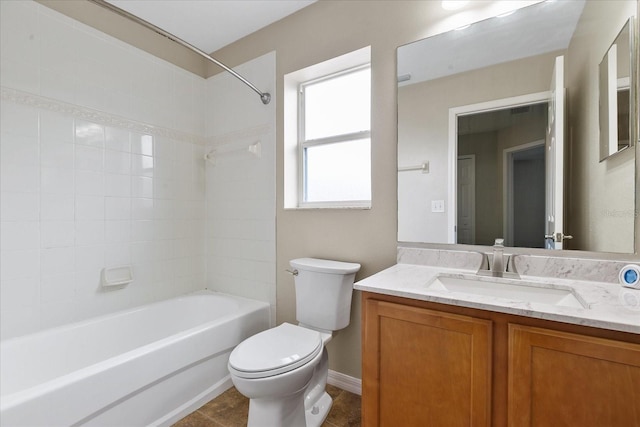 bathroom featuring vanity, toilet, and bathing tub / shower combination