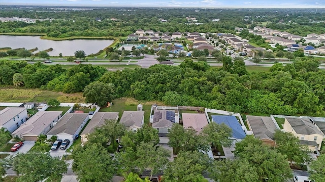 bird's eye view featuring a water view and a residential view