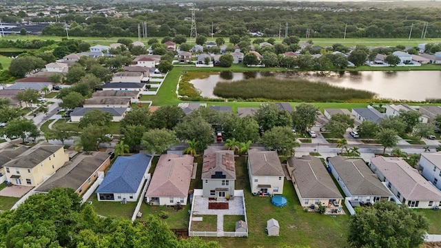 bird's eye view featuring a water view and a residential view