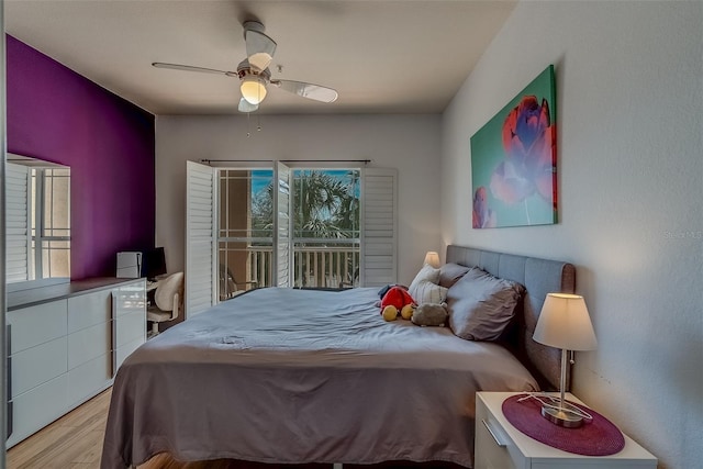 bedroom featuring light wood-style floors, ceiling fan, and access to exterior