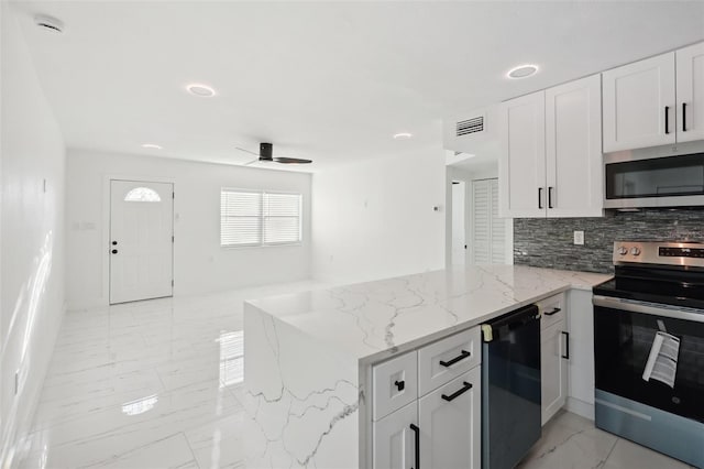 kitchen with visible vents, white cabinets, appliances with stainless steel finishes, a peninsula, and marble finish floor