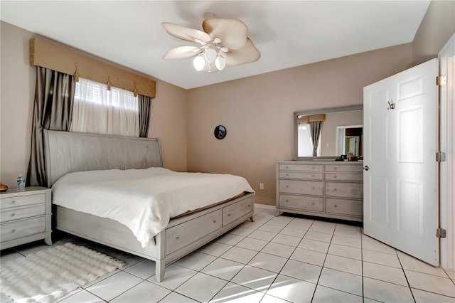 bedroom with light tile patterned flooring and ceiling fan