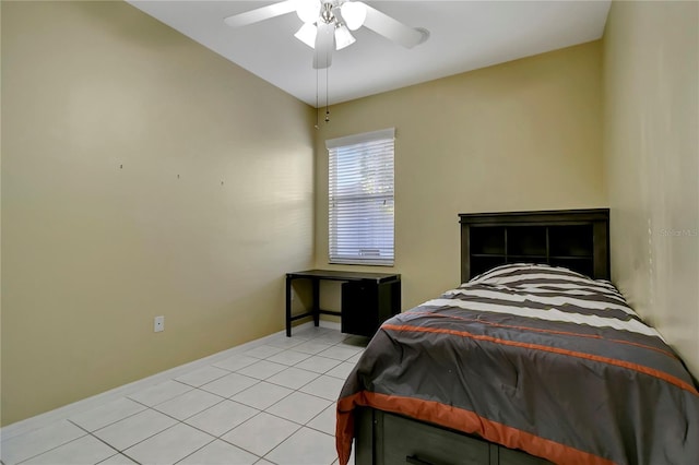 bedroom featuring light tile patterned floors, a ceiling fan, and baseboards