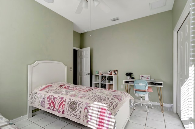 bedroom with light tile patterned floors, baseboards, visible vents, and a ceiling fan