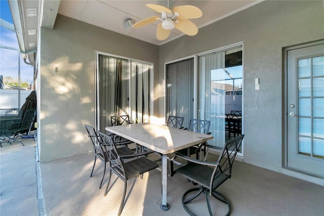 view of patio / terrace with ceiling fan and outdoor dining area