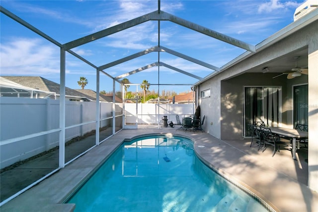 view of pool featuring a ceiling fan, a fenced in pool, a fenced backyard, and a patio