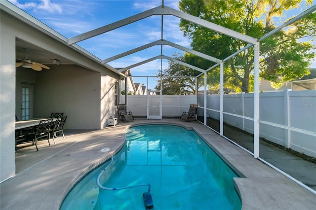 view of swimming pool featuring ceiling fan, a patio, a fenced backyard, and a fenced in pool