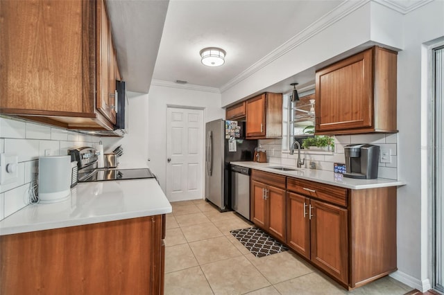 kitchen featuring crown molding, appliances with stainless steel finishes, light tile patterned flooring, brown cabinetry, and a sink