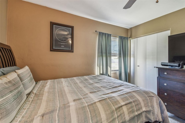 bedroom featuring a ceiling fan and a closet