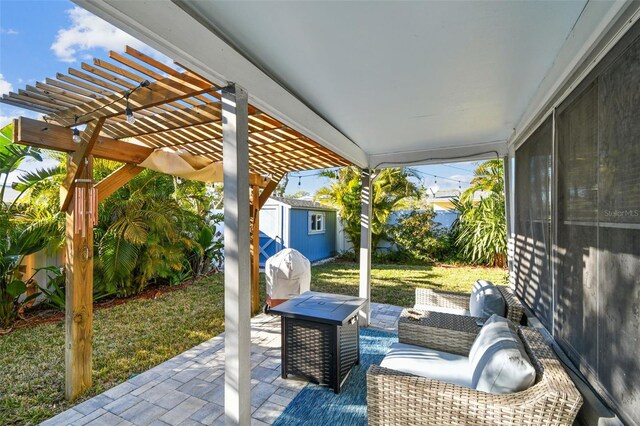 view of patio / terrace with a pergola, a storage shed, a grill, an outdoor structure, and an outdoor hangout area