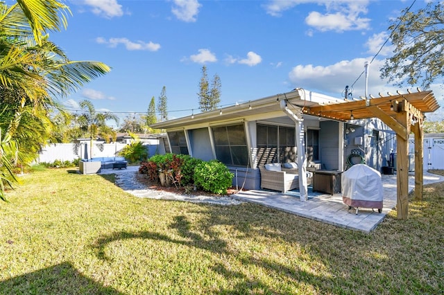 rear view of house with a jacuzzi, a yard, a fenced backyard, and a patio area