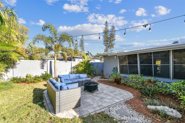 view of patio / terrace featuring an outdoor living space with a fire pit and a fenced backyard