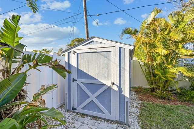 view of shed with a fenced backyard