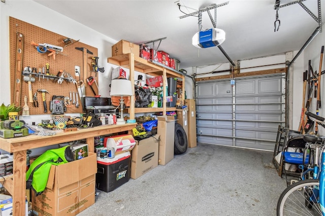 garage featuring a workshop area and a garage door opener