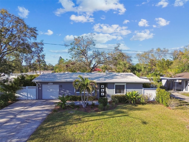 ranch-style home with a gate, fence, driveway, a front lawn, and a tiled roof