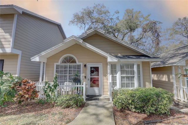 view of front of house featuring a porch and a shingled roof