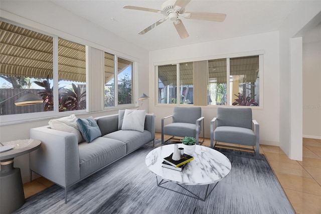 tiled living room with a ceiling fan