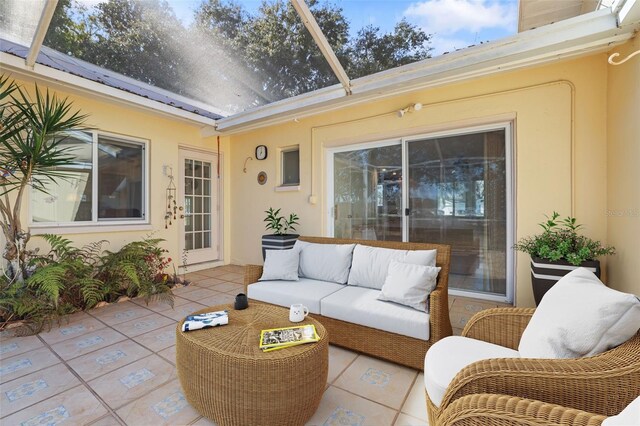 1549 San Christopher Dr, Dunedin, FL 34698 - view of patio featuring an outdoor hangout area and glass enclosure