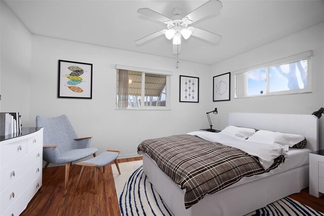 1549 San Christopher Dr, Dunedin, FL 34698 - bedroom with wood finished floors, a ceiling fan, and baseboards