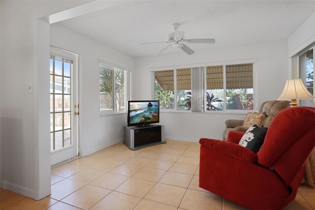 1549 San Christopher Dr, Dunedin, FL 34698 - sitting room featuring light tile patterned floors, ceiling fan, and baseboards