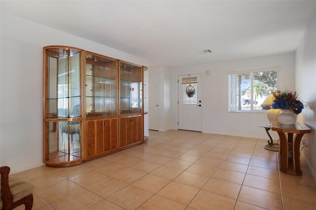 1549 San Christopher Dr, Dunedin, FL 34698 - entrance foyer with light tile patterned floors and visible vents