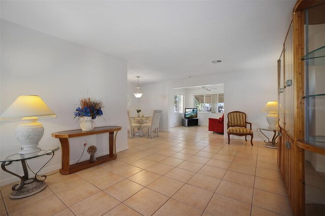 1549 San Christopher Dr, Dunedin, FL 34698 - interior space with visible vents, baseboards, and light tile patterned flooring