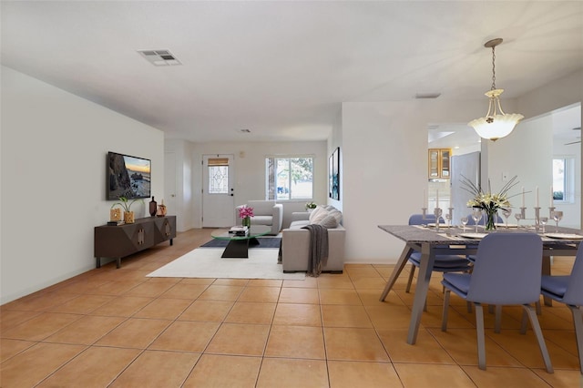 1549 San Christopher Dr, Dunedin, FL 34698 - living area with light tile patterned flooring and visible vents