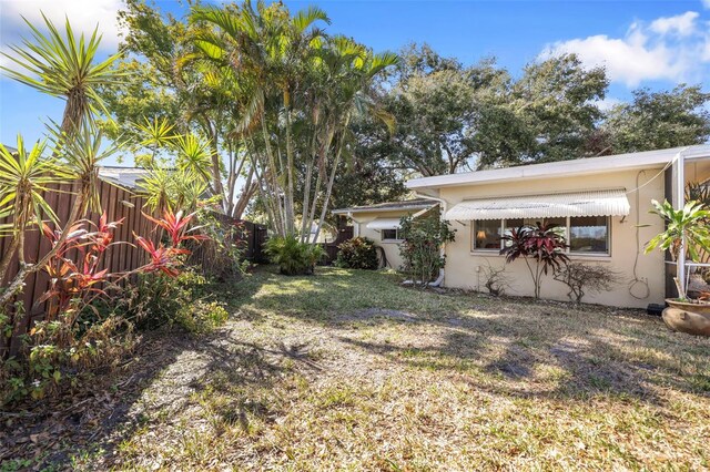 1549 San Christopher Dr, Dunedin, FL 34698 - view of yard featuring fence private yard