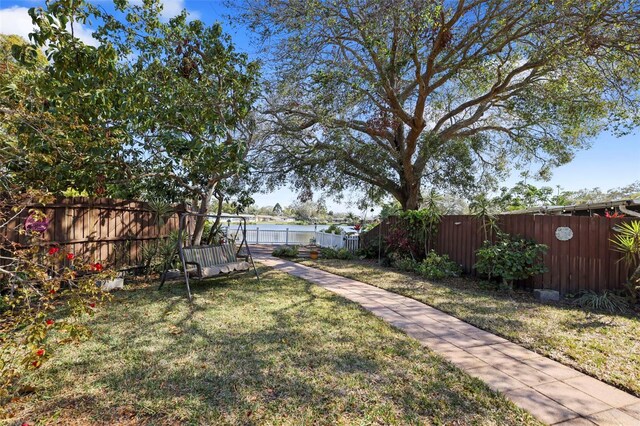 1549 San Christopher Dr, Dunedin, FL 34698 - view of yard featuring a fenced backyard