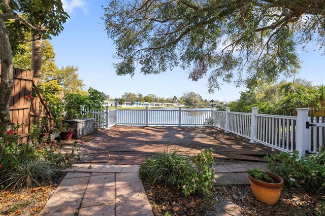 1549 San Christopher Dr, Dunedin, FL 34698 - view of patio / terrace with a water view, fence, and a gate