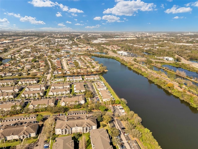 birds eye view of property with a water view and a residential view