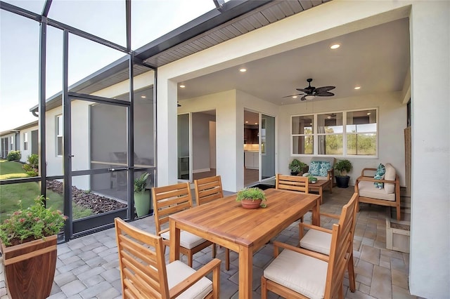 sunroom with a ceiling fan