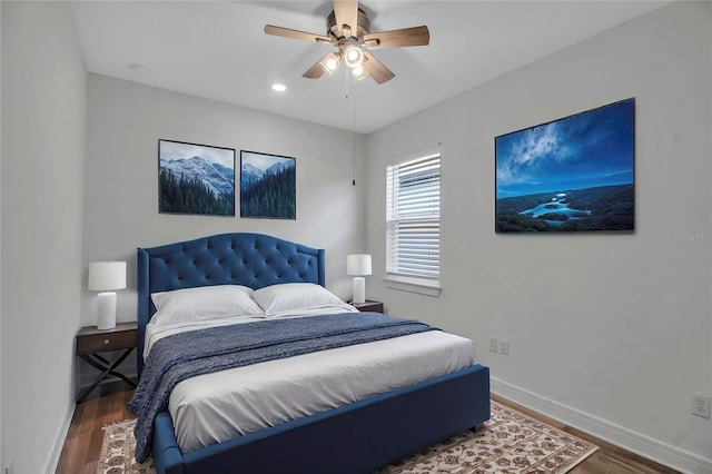 bedroom featuring ceiling fan, baseboards, wood finished floors, and recessed lighting