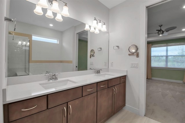 full bathroom with plenty of natural light, a sink, and ceiling fan