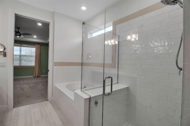 bathroom featuring ceiling fan, recessed lighting, baseboards, a shower stall, and a bath