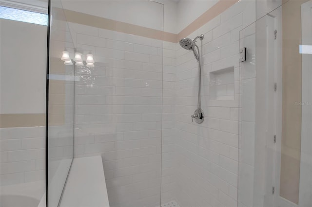 bathroom with tiled shower