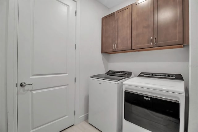 laundry room featuring cabinet space and independent washer and dryer