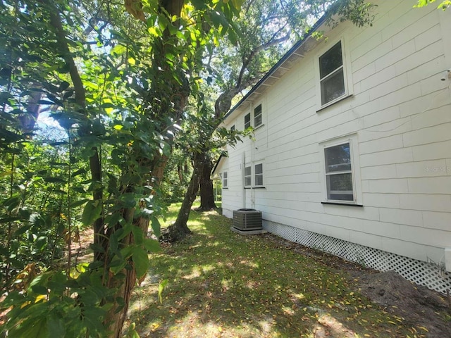 view of property exterior with central AC