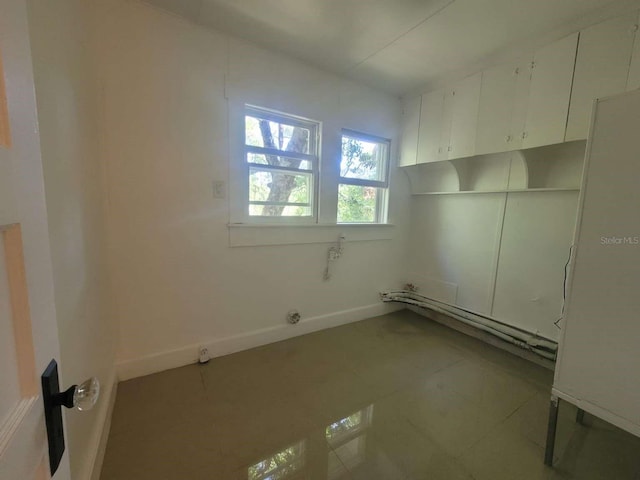 washroom featuring tile patterned flooring and baseboards