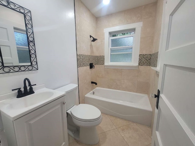 full bathroom featuring washtub / shower combination, vanity, toilet, and tile patterned floors