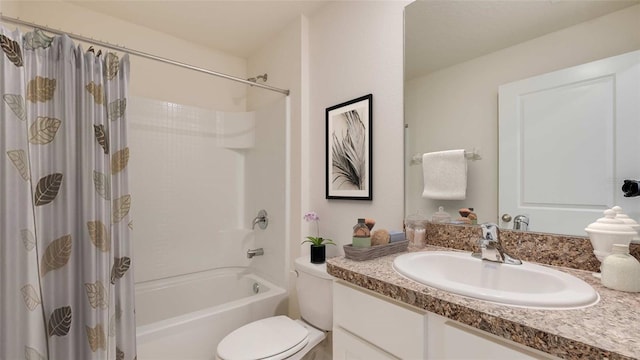 bathroom featuring toilet, shower / bath combo with shower curtain, and vanity